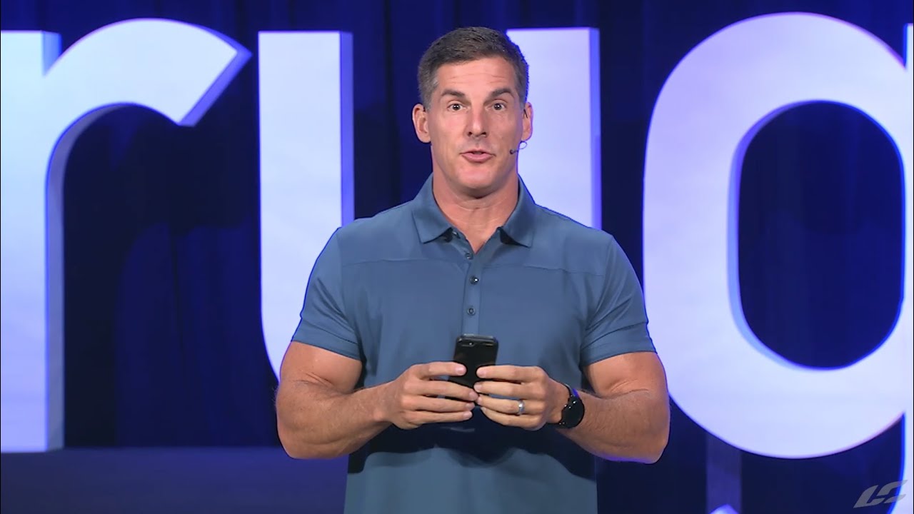 Craig Groeschel Talking On The Stage While Holding A Phone