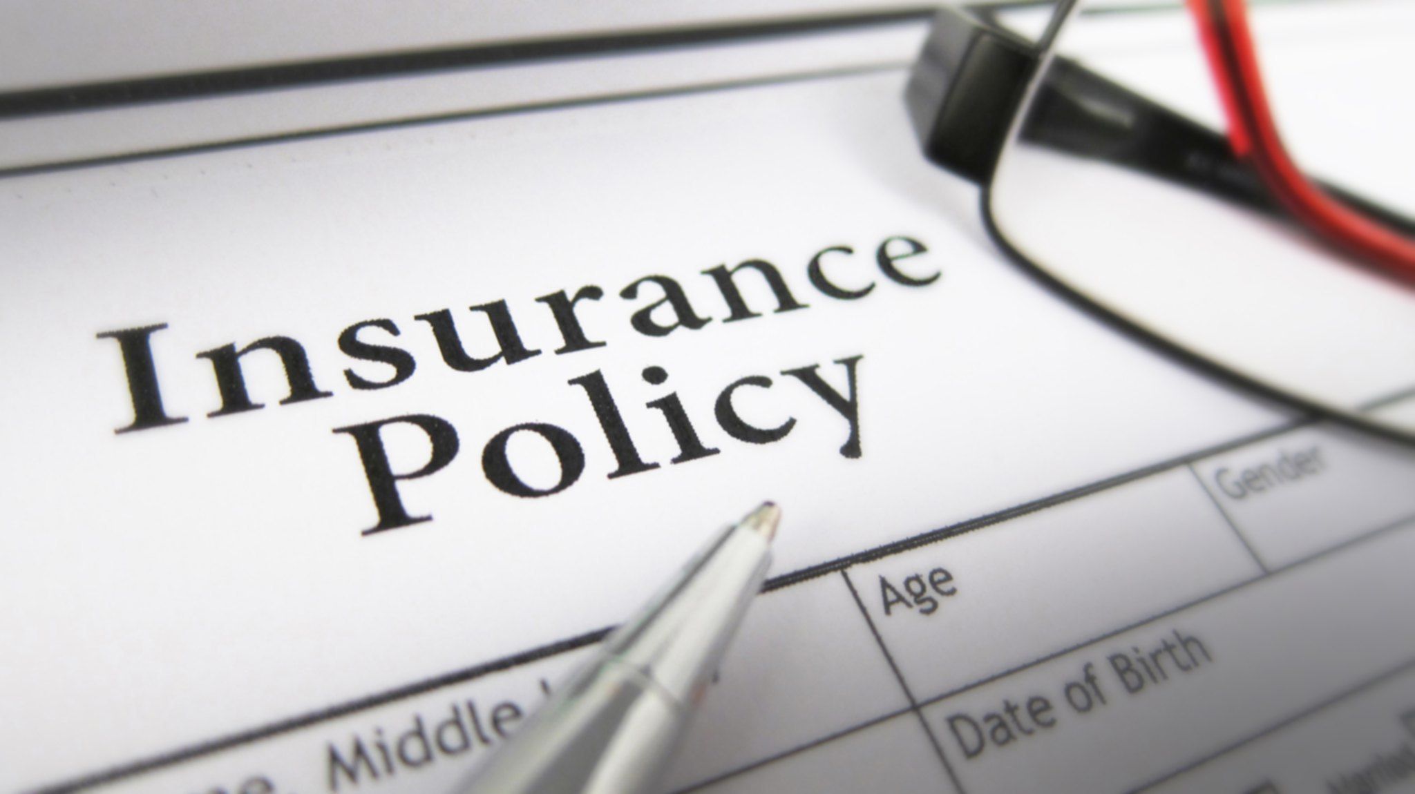 Insurance Policy on a paper with pen
